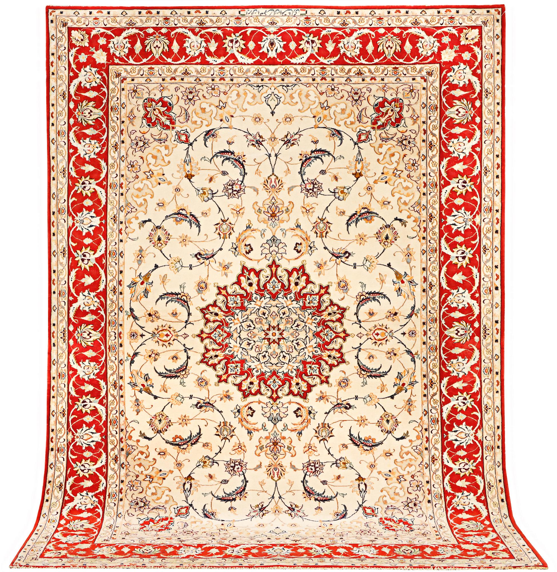 A semi-antique part silk Isfahan rug, a. 238 x 156 cm.