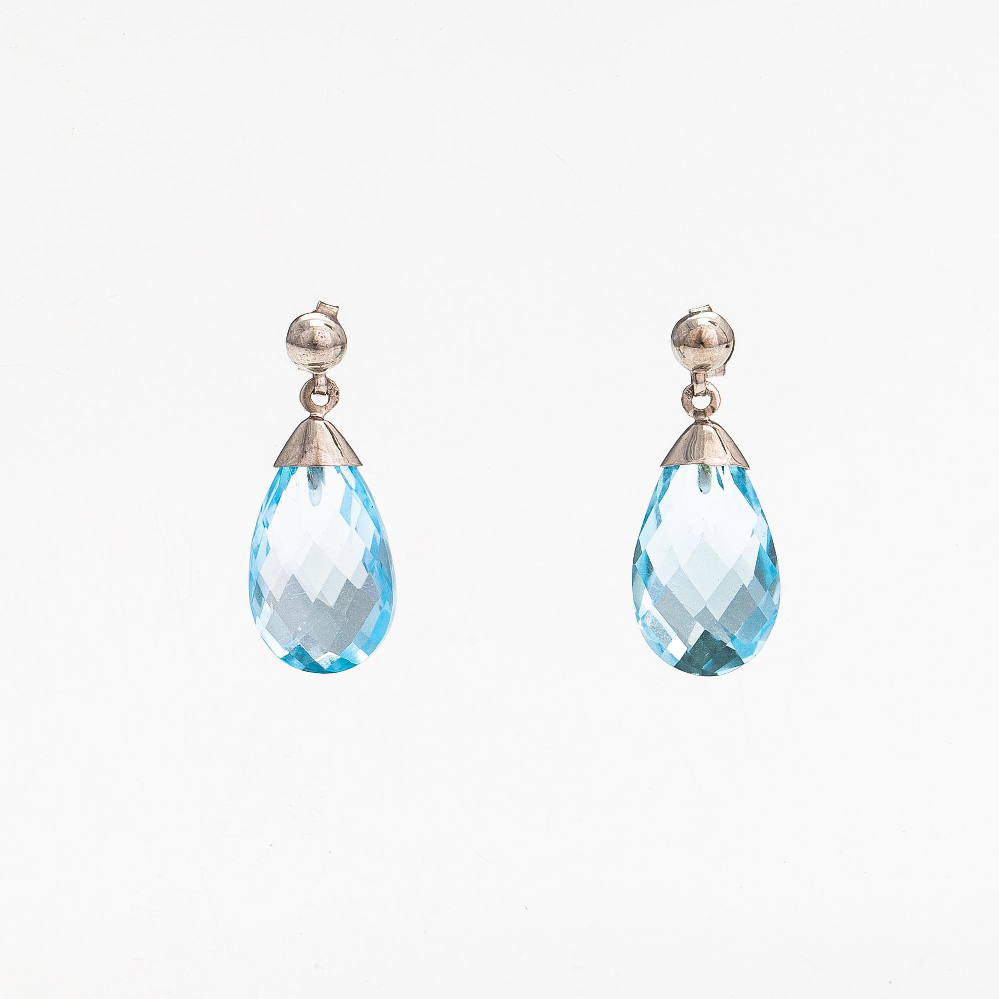 A pair of 14K white gold and topaz earrings.