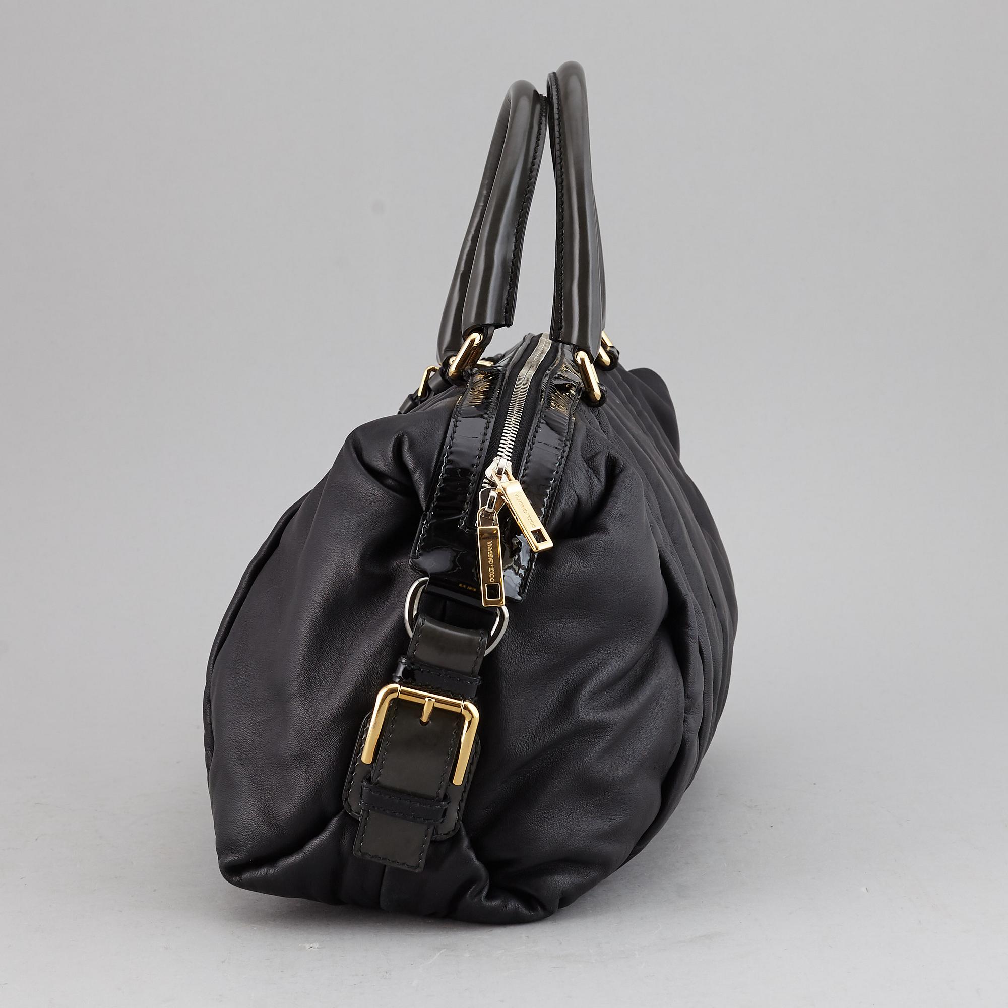 DOLCE & GABBANA, a black leather bag.