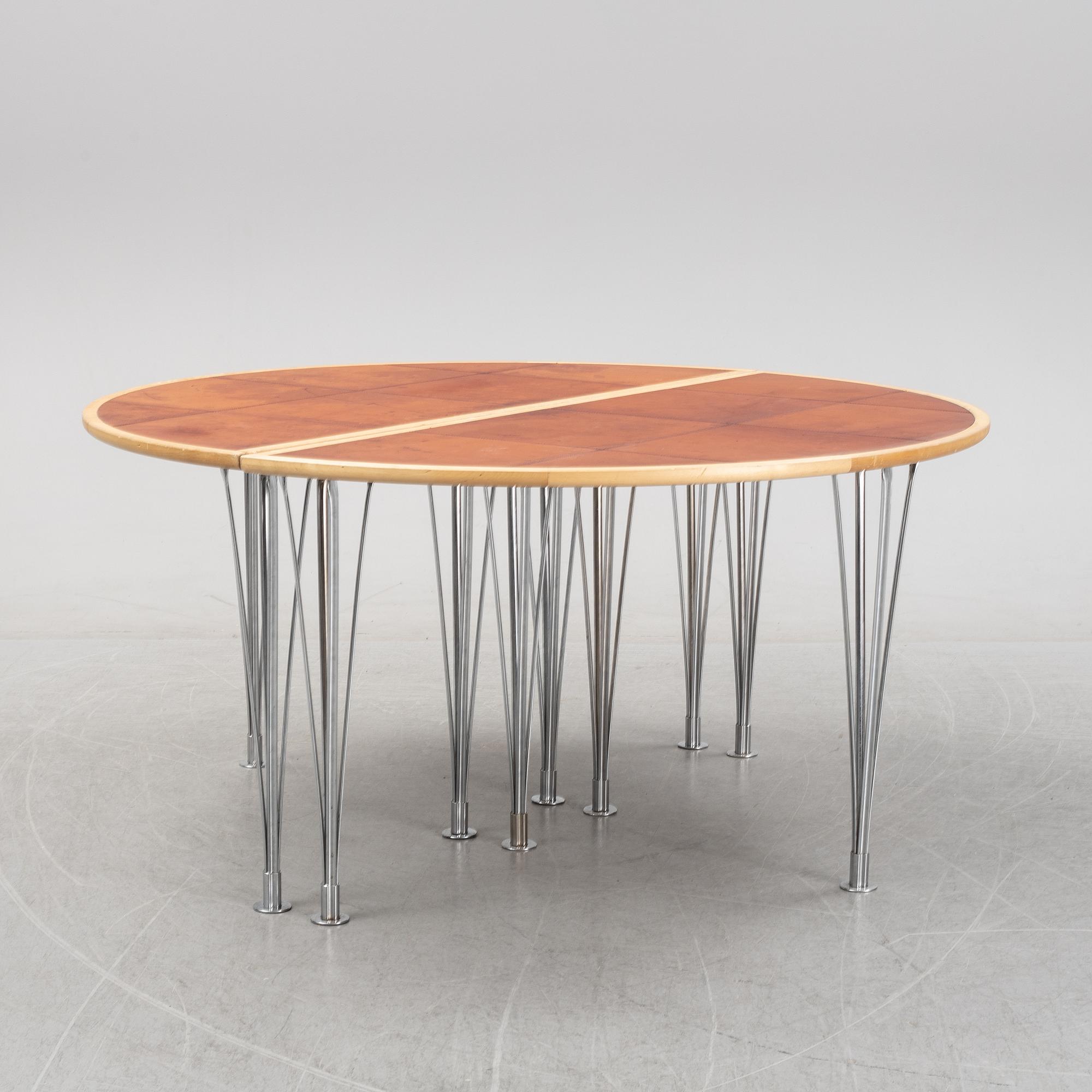 A birch and leather dining table in two parts, Mathsson International, 21th century.