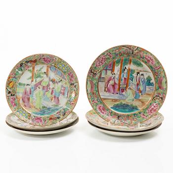 A matched set of 14 famille rose 'Canton' dinner plates, Qing dynasty, 19th century.