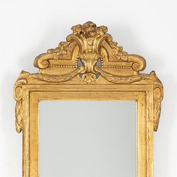 A Gustavian giltwood mirror, 1770's.