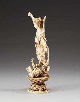 An ivory figure of Guanyin, Qing dynasty. Signed at base.