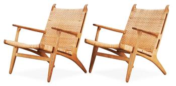 55. A pair of Hans J Wegner oak and rattan 'CH-27' armchairs, Carl Hansen & Son, Denmark, 1950's-60's.