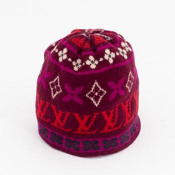 Louis Vuitton, a knitted cashmere hat and scarf.