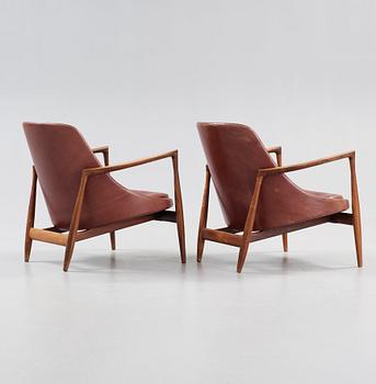 A pair of Ib Kofod Larsen palisander and brown leather 'Elisabeth' easy chairs, Denmark 1950's-60's.