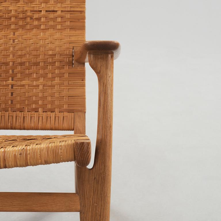 A Hans J Wegner oak and rattan easy chair 'CH-27', Carl Hansen & Son, Denmark,