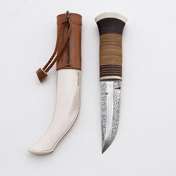 A reindeer horn and skin knife by Bertil Fällman, signed.