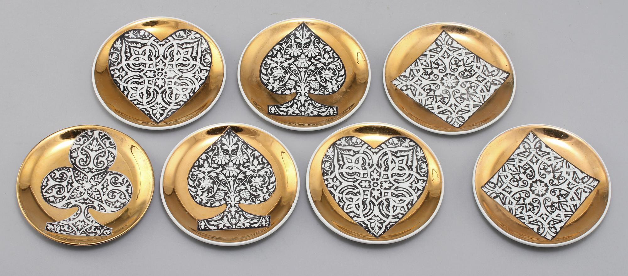 GLASUNDERLÄGG, 7 st, porslin, Fornasetti, Milano, Italien. 1900-talets tredje kvartal.