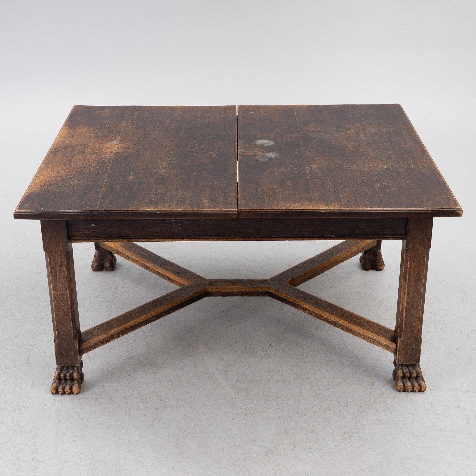 A Baroque-style dining table with six chairs, around 1900.
