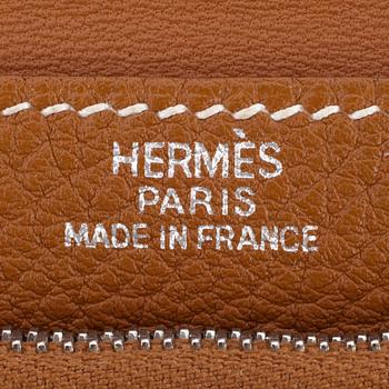 HERMÈS, a brown leather wallet, "Dogon".