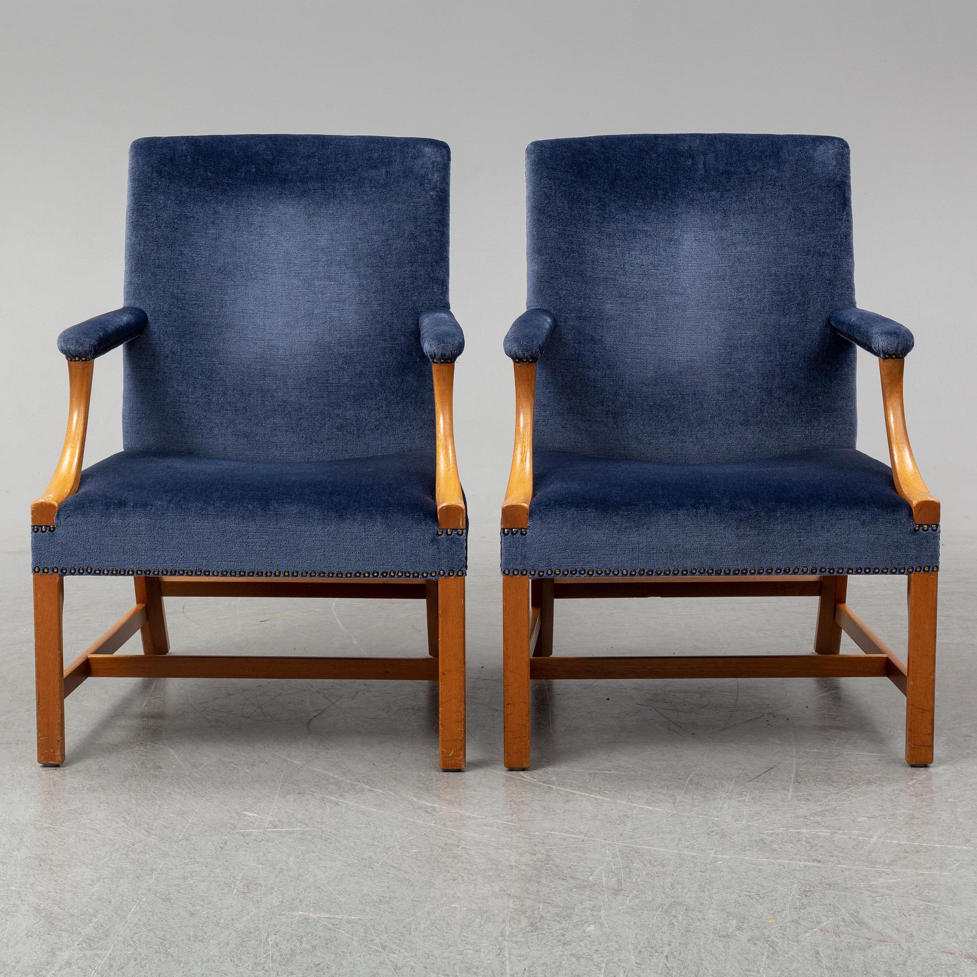 A mid 20th Century pair of oak armchairs attributed to Carl Malmsten.
