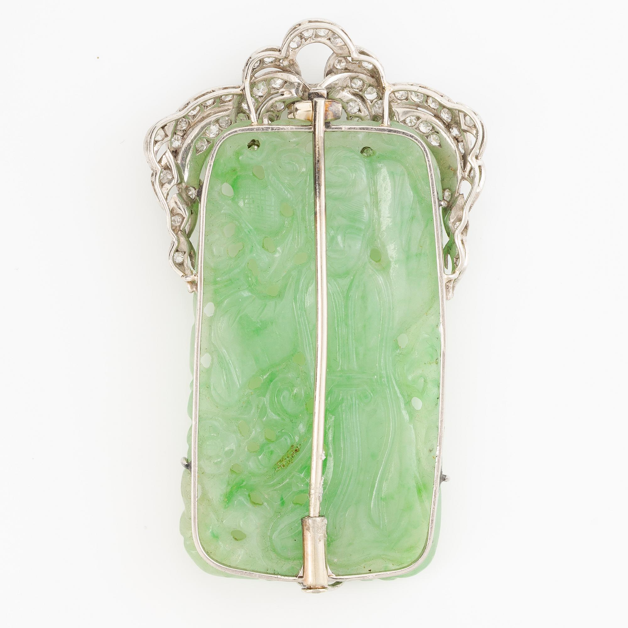 Brooch, platinum with carved jade and octagon-cut diamonds.