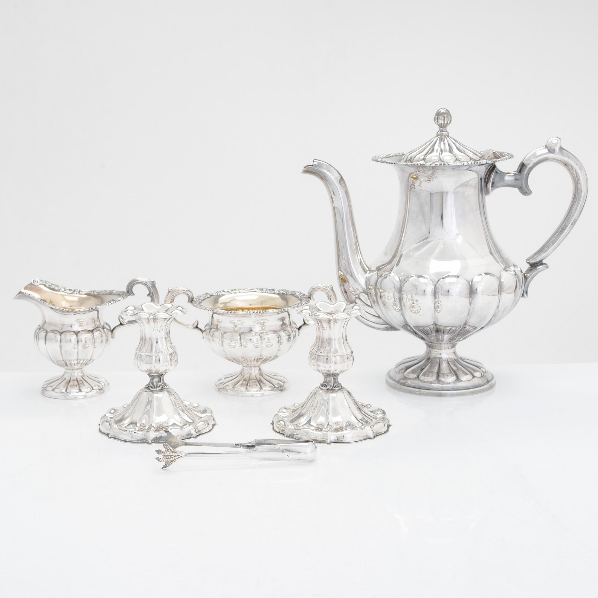 Silver sugar tongs, Herman Wist, Uusikirkko, Carelia 1928, a 3-piece coffee service, a candlestick pair, Finland 1950s.