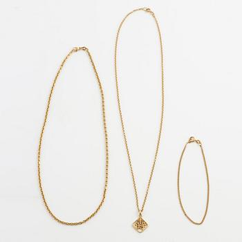 Two neck chains, one with a pendant and one bracelet, 18K gold.