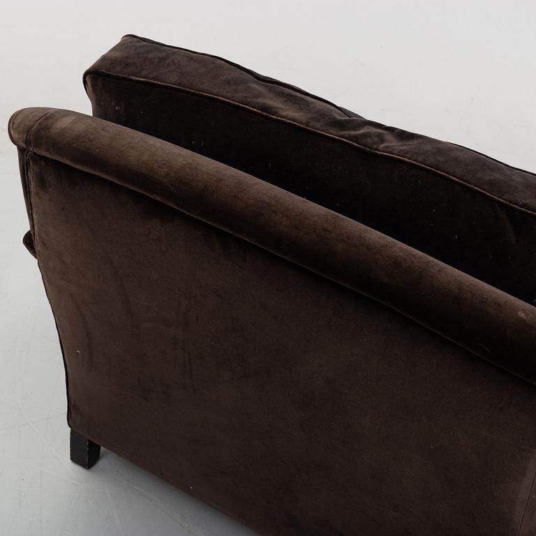 A contemporary velvet Howard sofa.