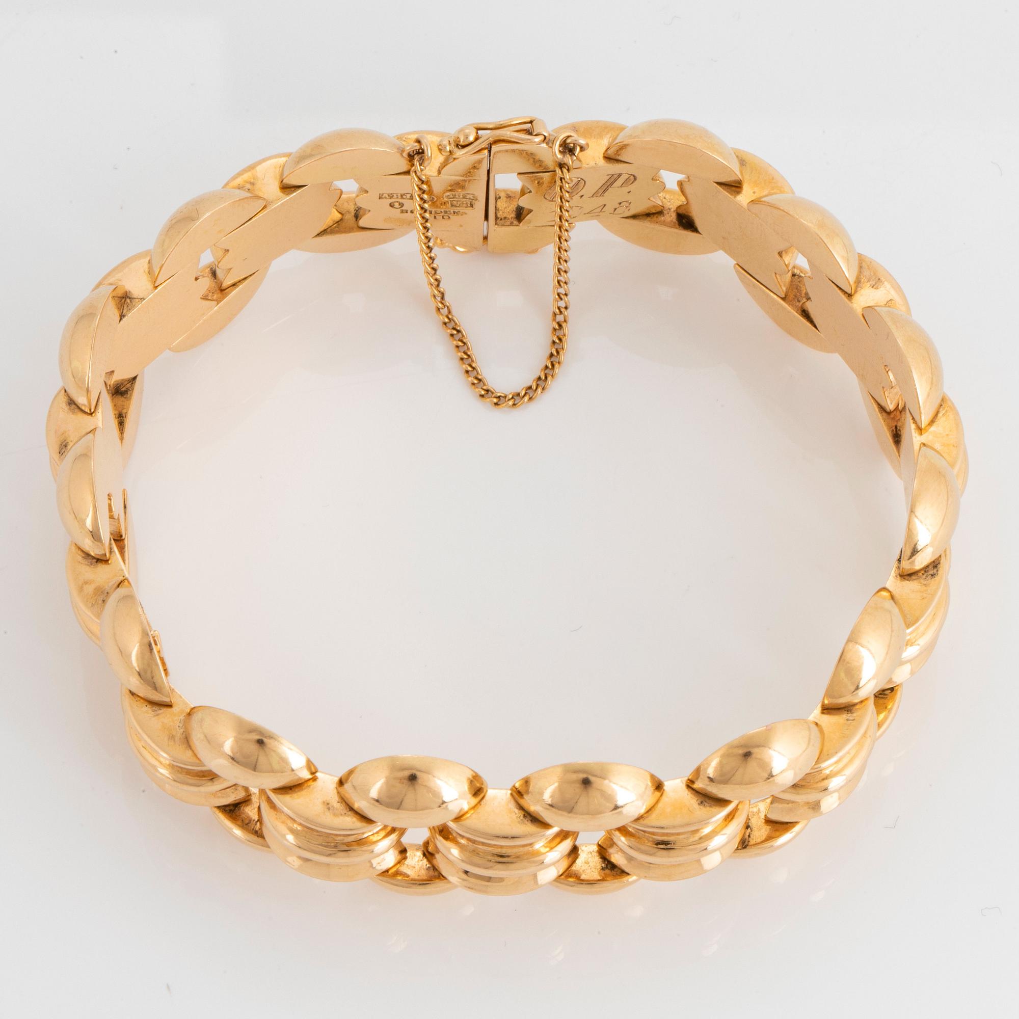 An 18K gold bracelet.