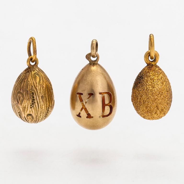 A collection of 24 egg pendants in original wooden box, Russia, early 20th century.