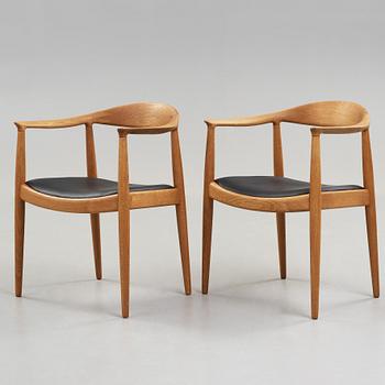 A pair of Hans J Wegner's oak 'The Chair' by Johannes Hansen, Copenhagen.