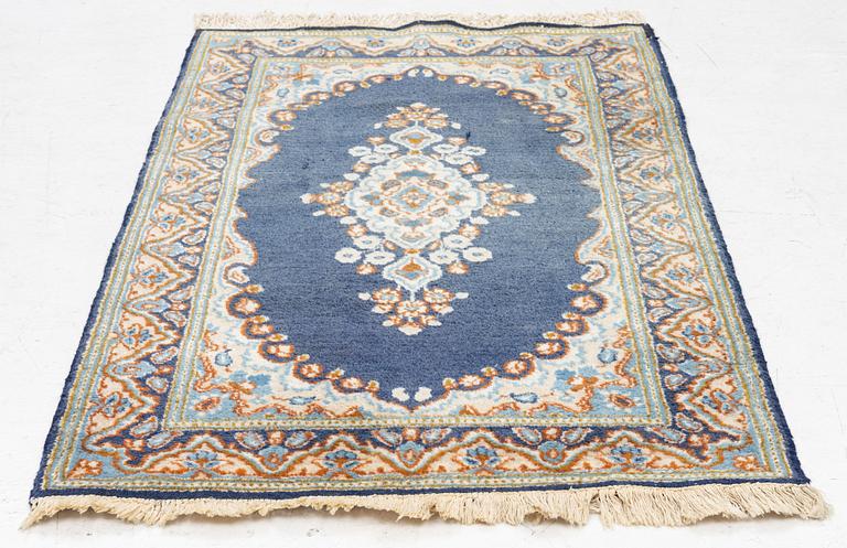 An old Kerman rug, ca. 130 x 91 cm.