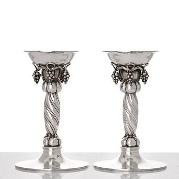 Georg Jensen, a pair of sterling silver grape decorated candlesticks, Copenhagen 1996, design nr 263B.