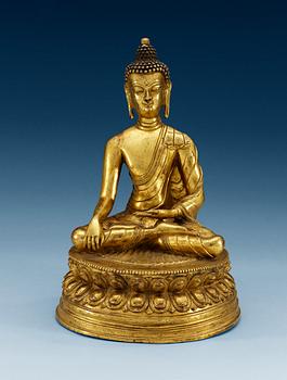 1487. A gilt bonze sinotibethan figure of a seated Buddha, 19th Century.