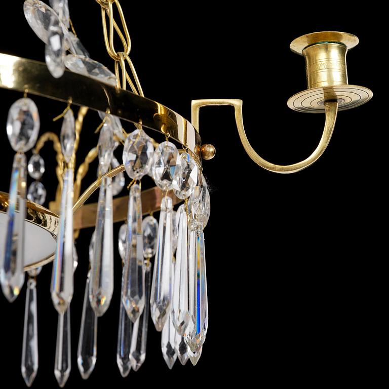 A late Gustavian gilt brass and cut glass four-light chandelier, Stockholm, late 18th century.