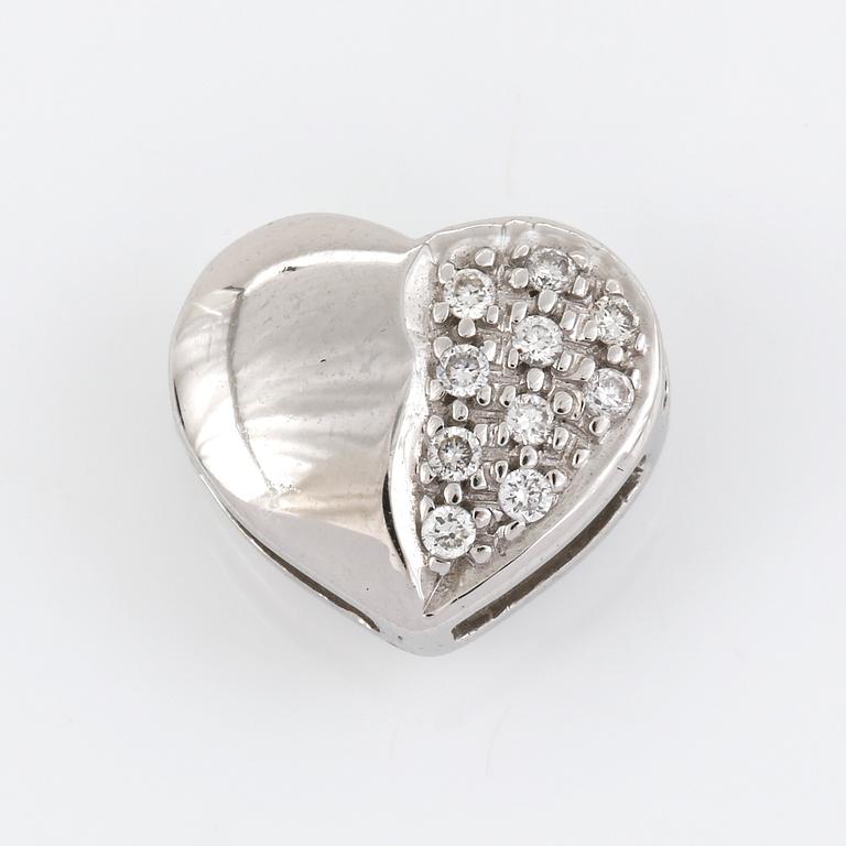 HÄNGE, vändbart i 18K vitguld, hjärta med sidledes öppning och diamanter ca 0.02ct.