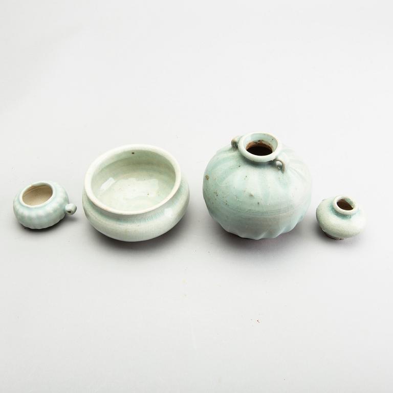 A group of four pale green glazed vessels, South East Asia, presumaby Sukothai, 14th/16th Century.