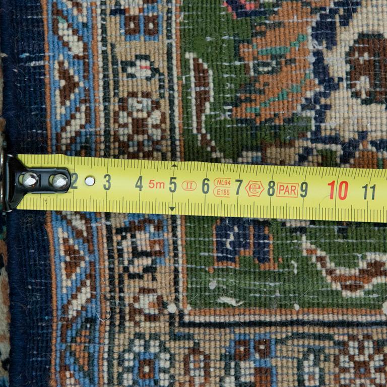 An oriental carpet. Qum. Circa 201x140 cm.