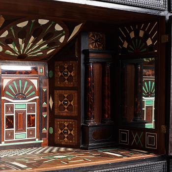 A Louis XIV and Louis XIV-style carved ebony, ivory and tortoiseshell-inlaid cabinet on stand, 17th and 19th century.