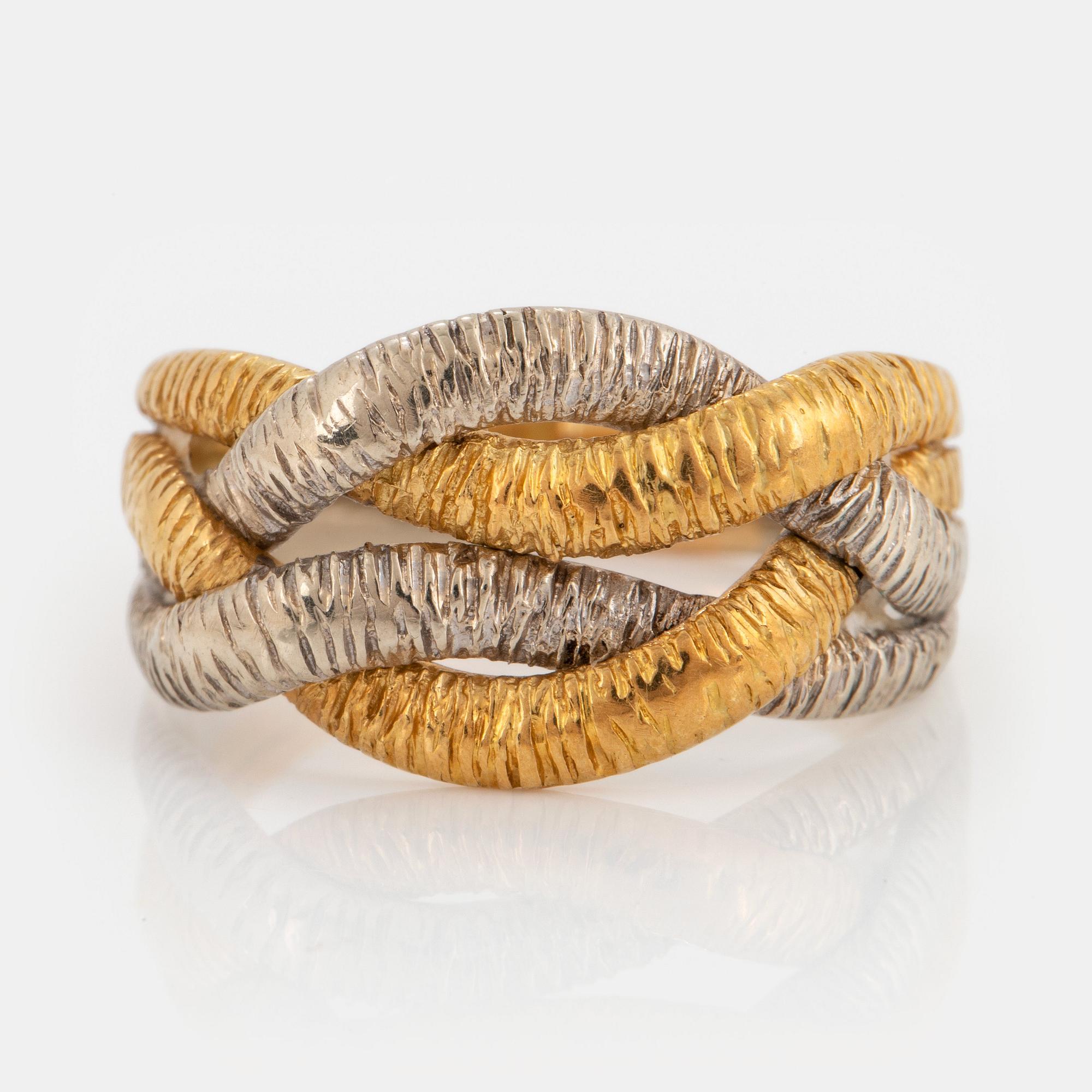 An 18K gold and white gold ring.