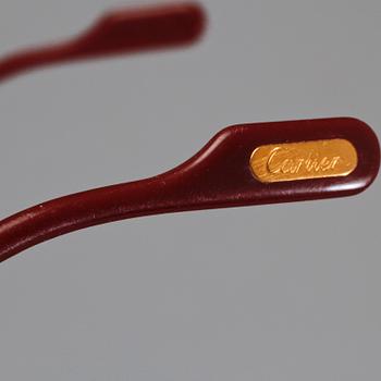 SOLGLASÖGON, Cartier.
