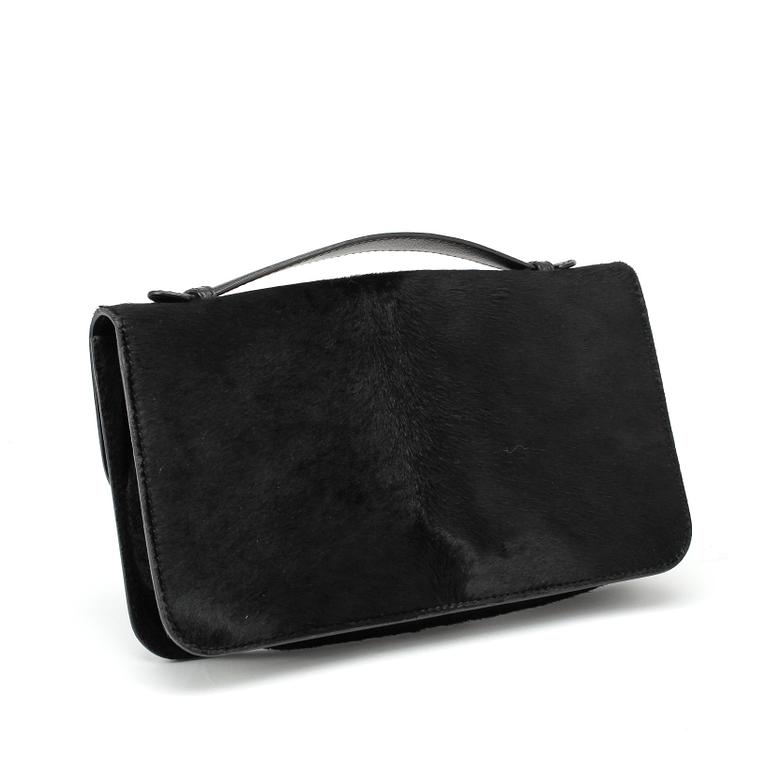 ALEXANDER MCQUEEN, a black pony hair clucth bag.