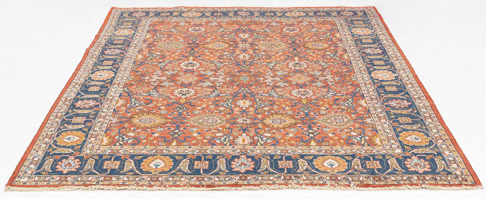 An antique/semi antique Tabriz carpet, c. 325 x 229 cm.