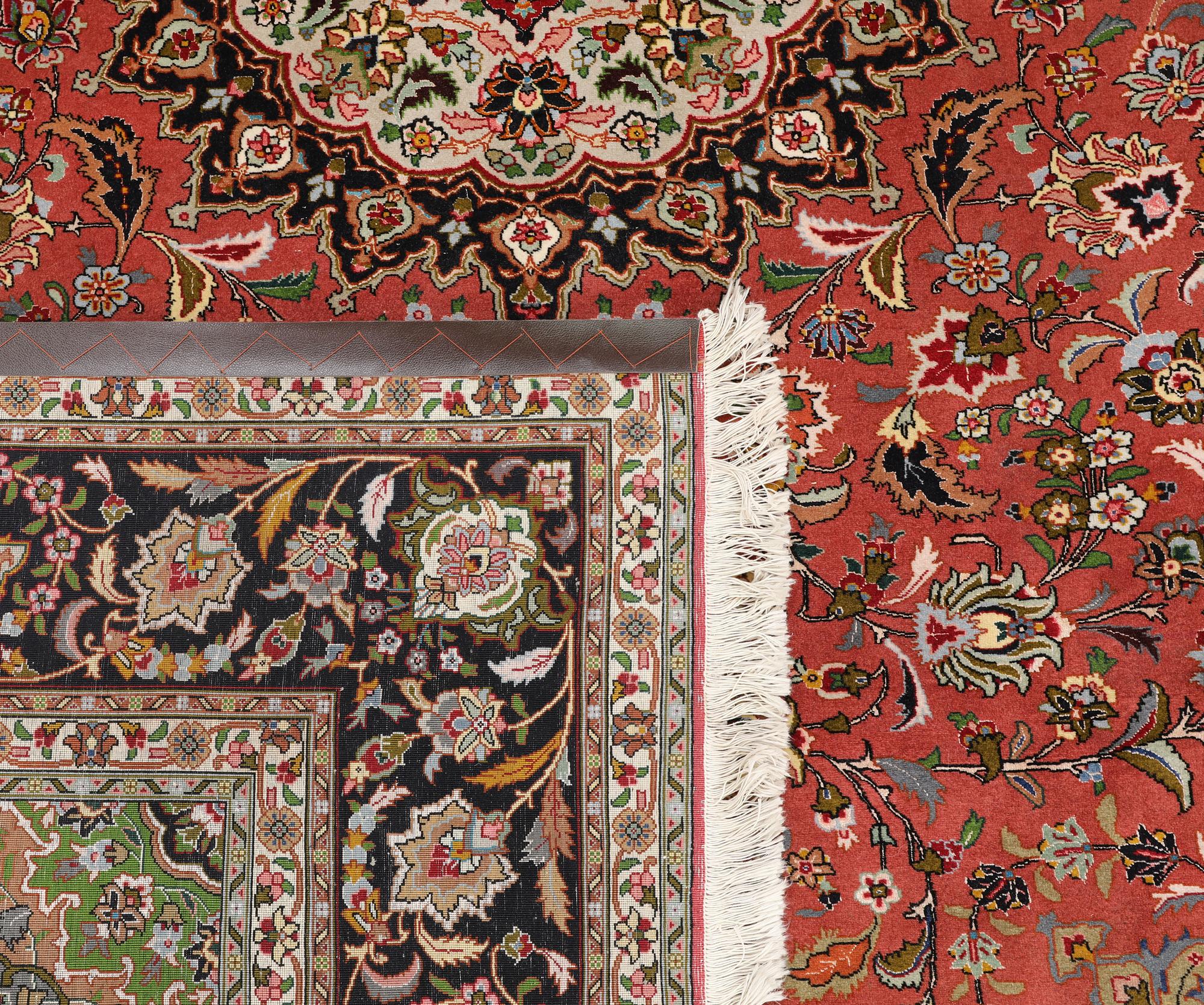 A part silk Tabriz carpet, approx. 50 Raj, 292 x 202 cm.