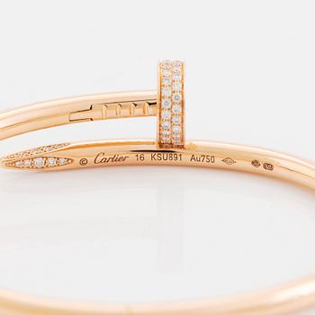 A Cartier "Juste en Clou" bracelet in 18K rose gold set with round brilliant-cut diamonds.