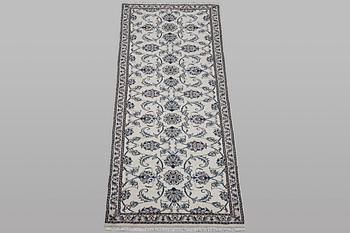 A runner carpet, Nain, part silk, ca 248 x 72 cm.