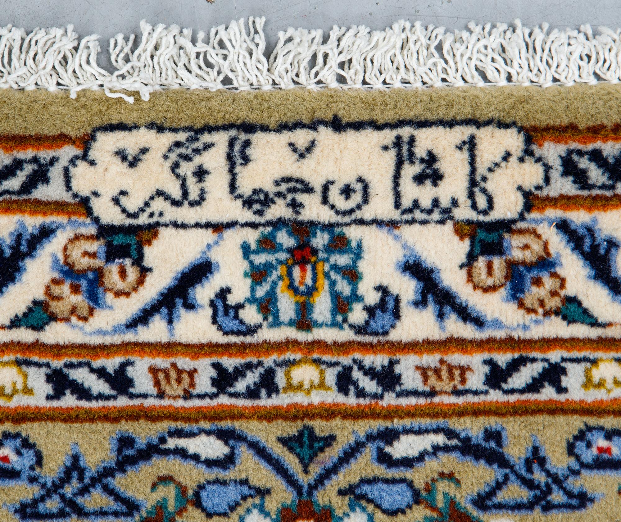 A carpet, Kashan signed, Janghair, ca 363 x 260 cm.