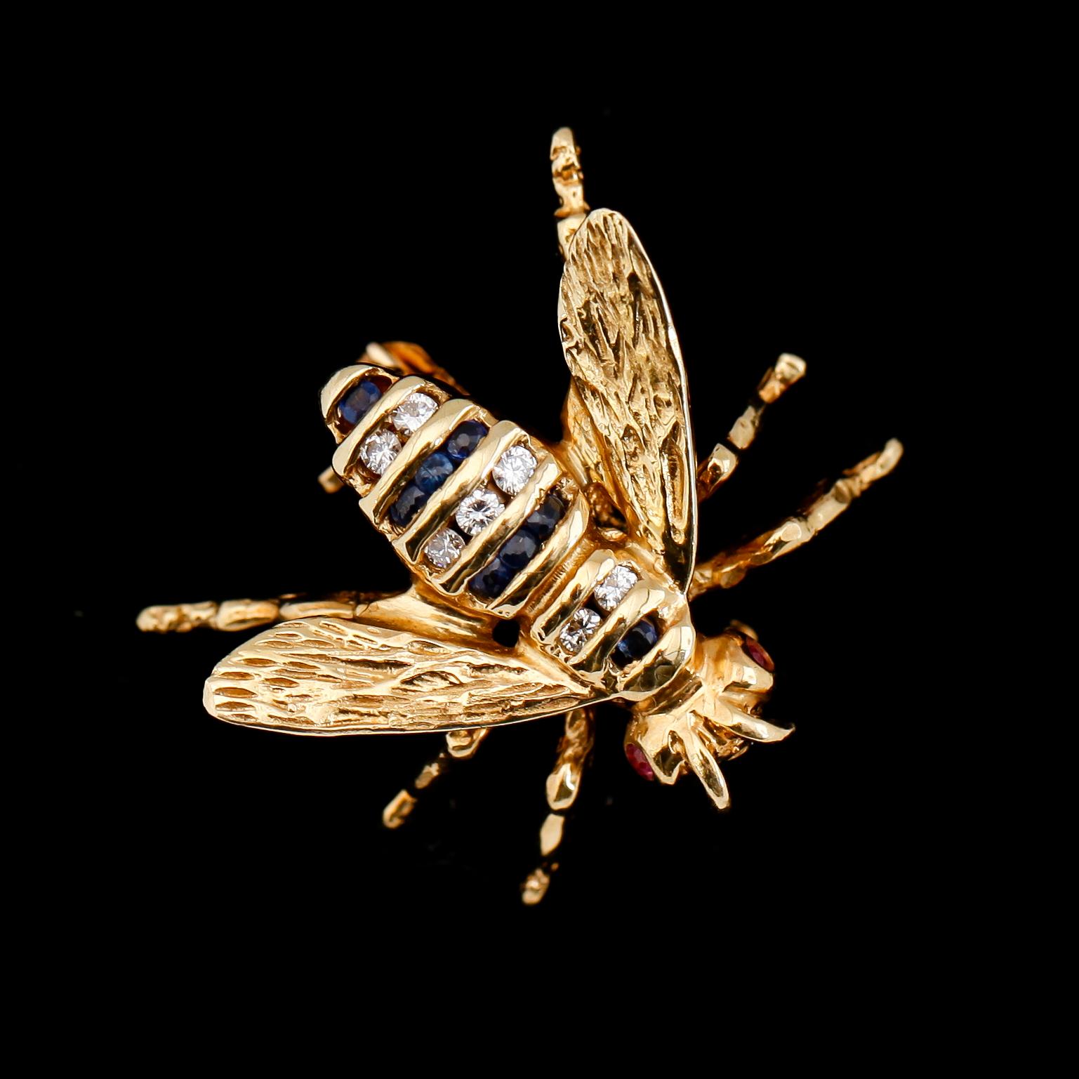 BROSCH, 18K guld, diamanter och blå safirer.