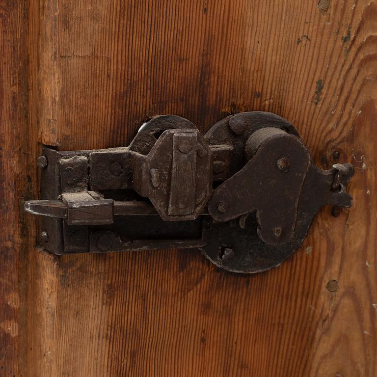 A corner cabinet, 18th Century.