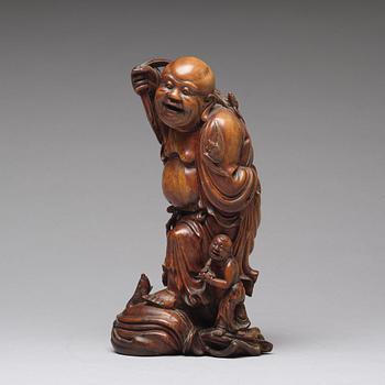 A root scultpure of buddai, Qing dynasty circa 1900.