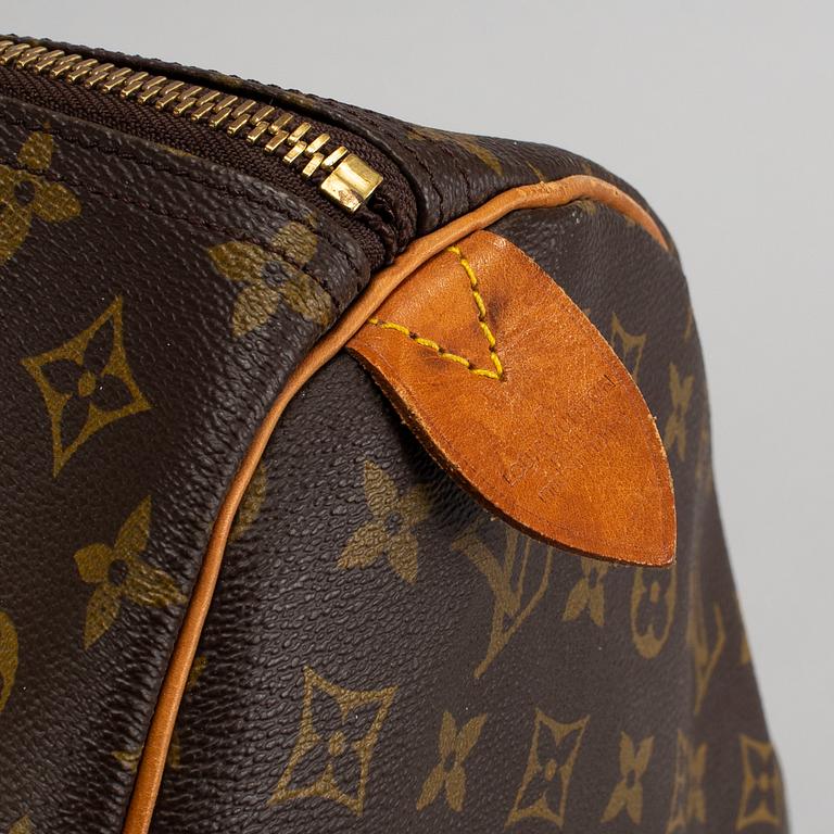 LOUIS VUITTON, a monogram canvas 'Keepall 60' weekend bag.