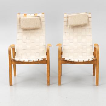 Yngve Ekström, a pair of "Primo" armchairs with ottomans, Swedese, Sweden,