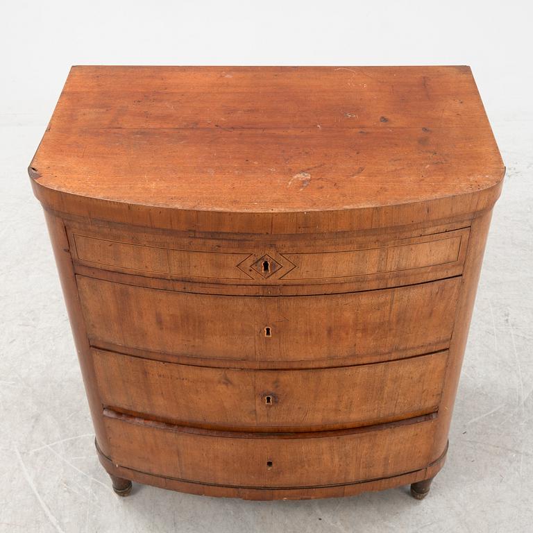 An empire style chest of drawers, 19th Century.