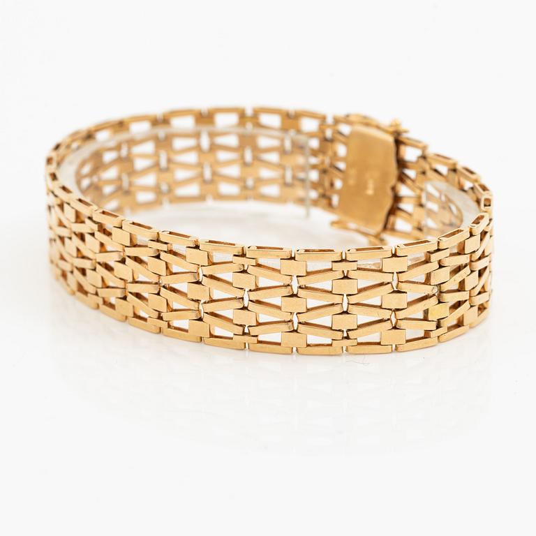 Arm bracelet, 18K gold.