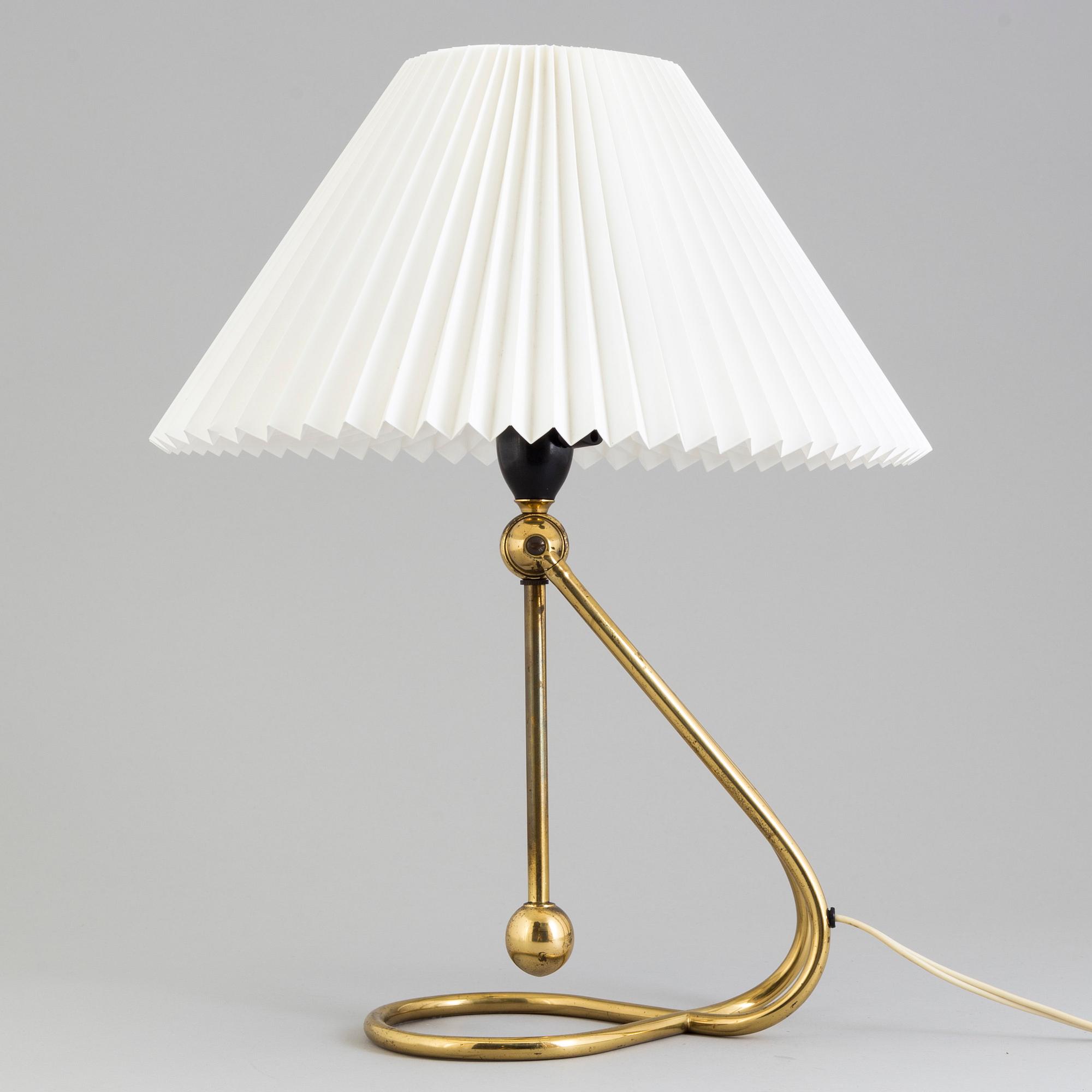A Le Klint brass table or wall lamp.