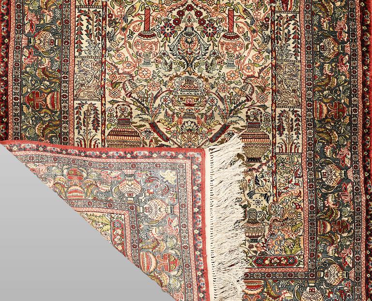 An oriental silk rug, c. 109 x 76 cm.