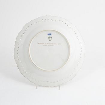 A set of three porcelain plates, Hausmalerei, Royal Copenhagen, Denmark.