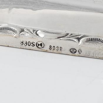 A Swedish Silver Ladle, mark of Adolf Öström, Piteå 1887 and a pair of Silver Candlesticks.